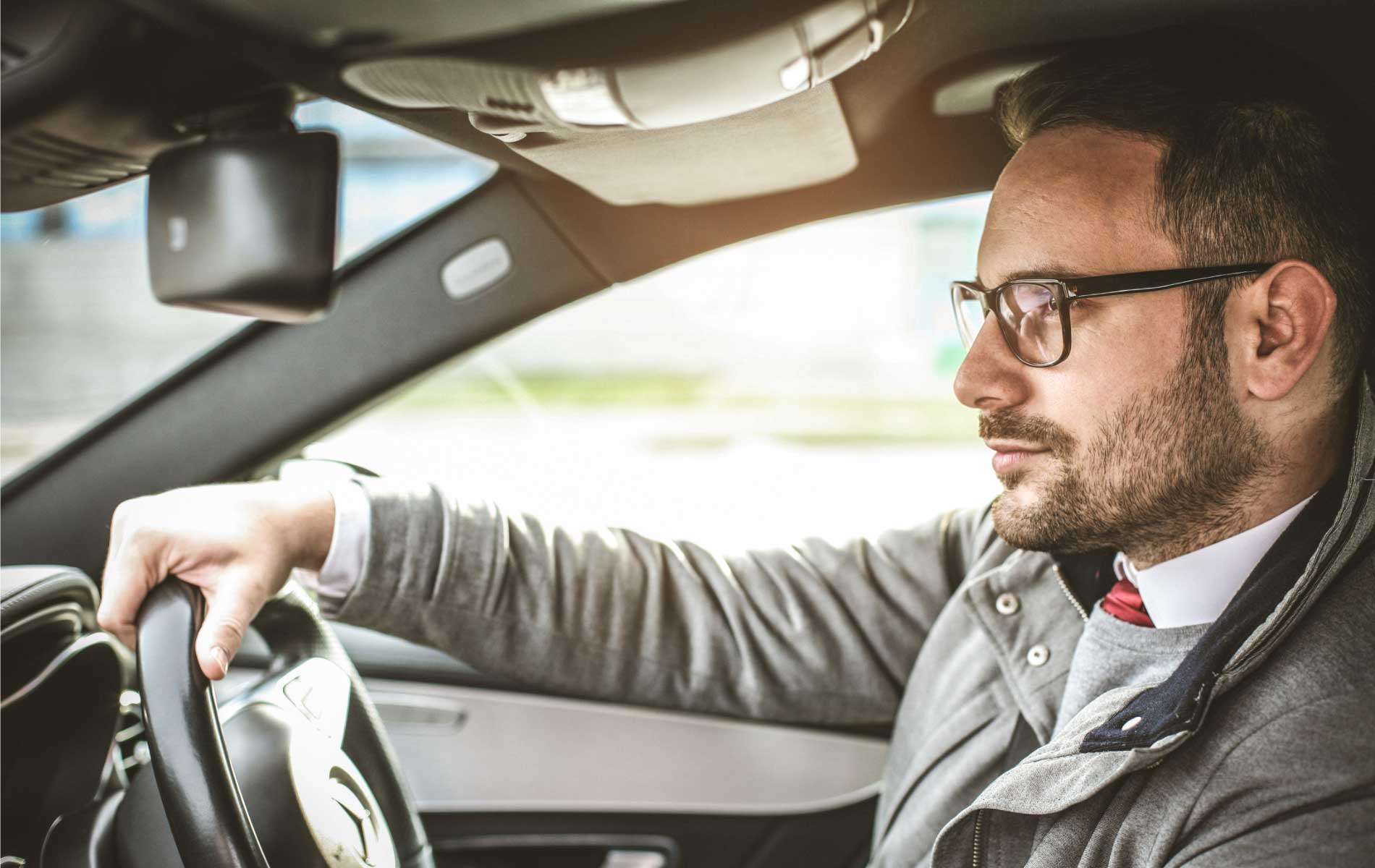 Man driving wearing drivewear lenses