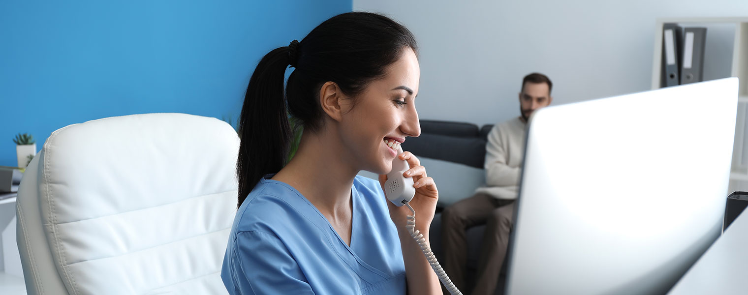 Woman taking booking over the phone