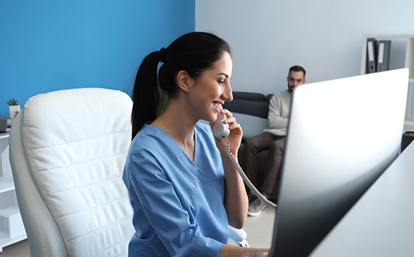 Woman taking booking over the phone