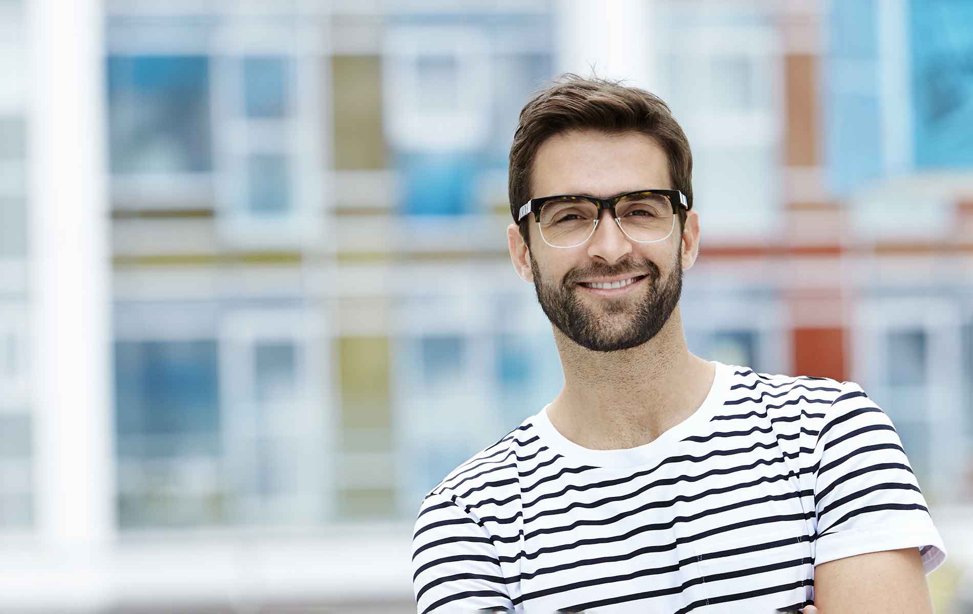 Man outdoors wearing glasses