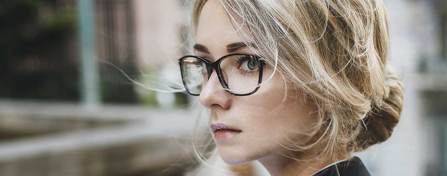 Close up of a girl wearing glasses. 