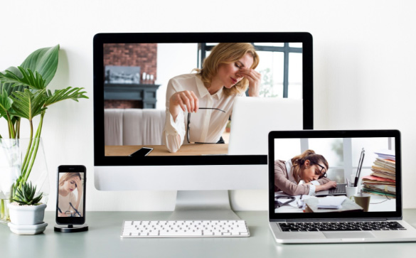 Picture of computer, laptop and mobile phone on a desk